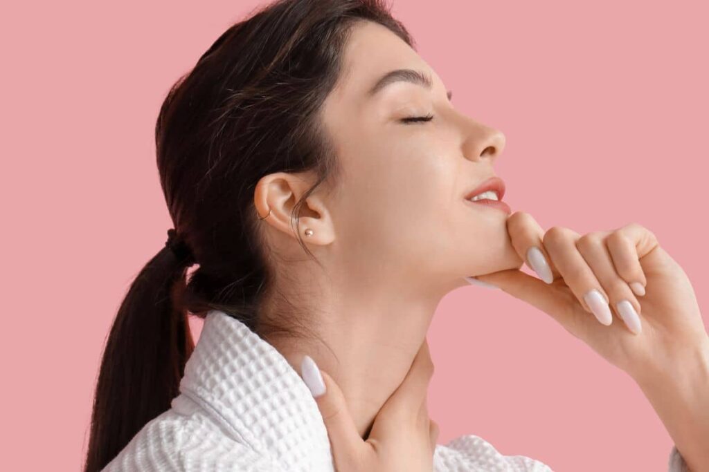 Woman with defined chin and smooth neck, symbolizing customized jawline contouring with both surgical and nonsurgical treatments.