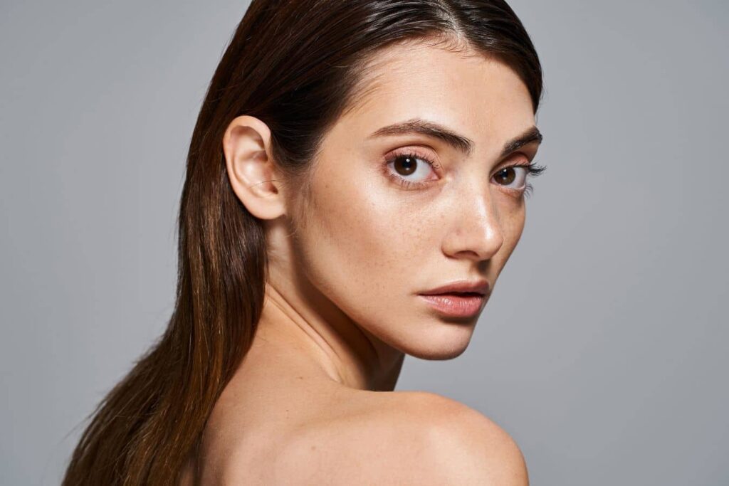 Woman with clear facial profile representing revision rhinoplasty recovery expectations after nose surgery