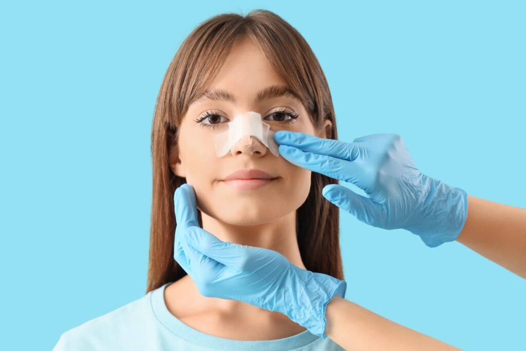 Patient with nasal splint during the first 24 hours of revision rhinoplasty recovery